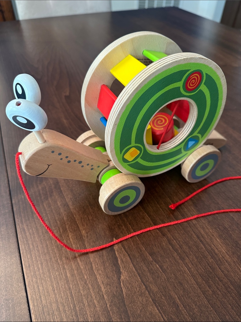 Hape Walk-A-Long Wooden Snail Toy - Green and Multi-Color